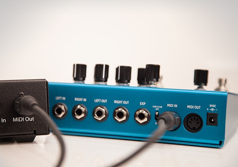 MIDI cable plugged into Strymon pedal and MIDI controller