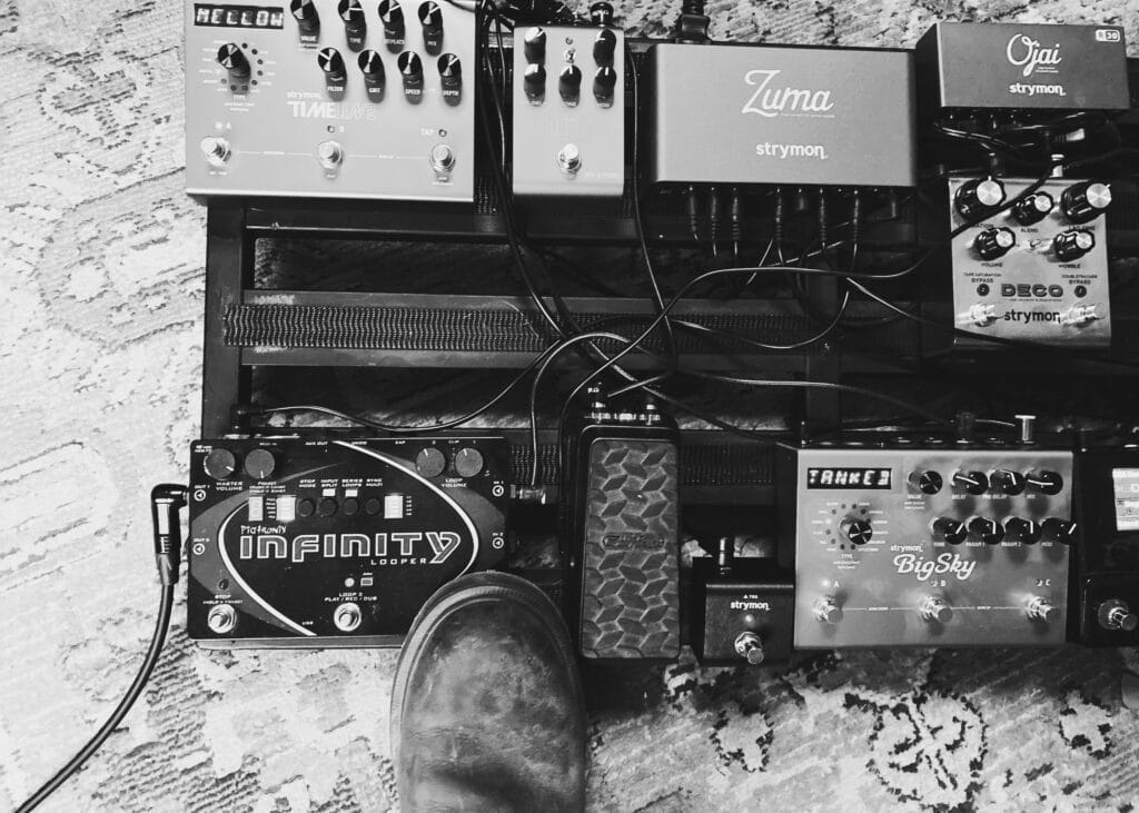 The author's pedalboard, featuring a variety of Strymon pedals, as well as a Pigtronix infinity looper and a Dunlop volume pedal.